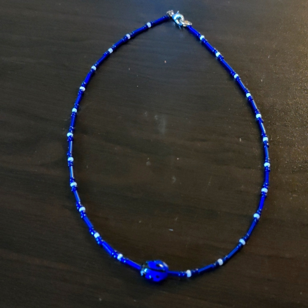 Blue black and white ladybug seed bead necklace